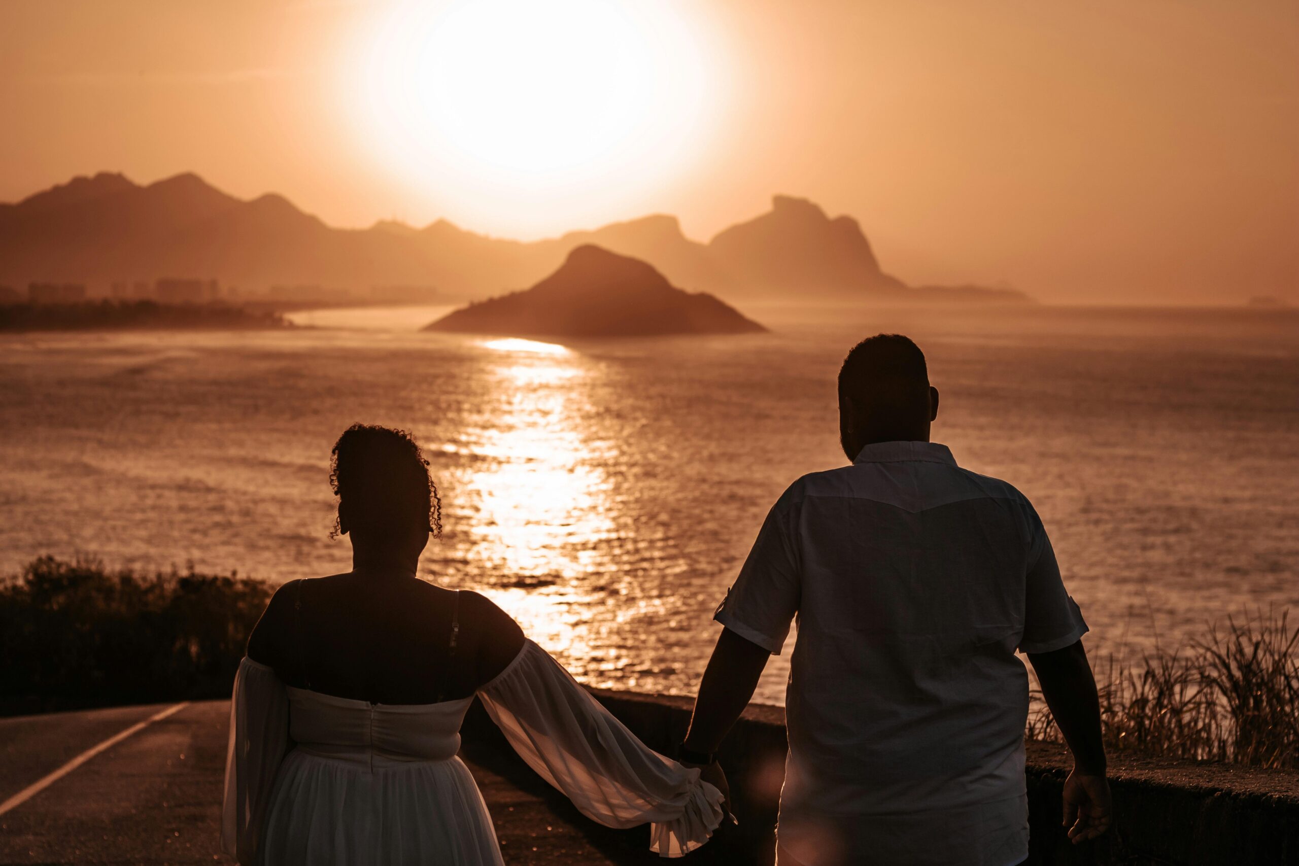 couple holding hands at the resort on the ocean