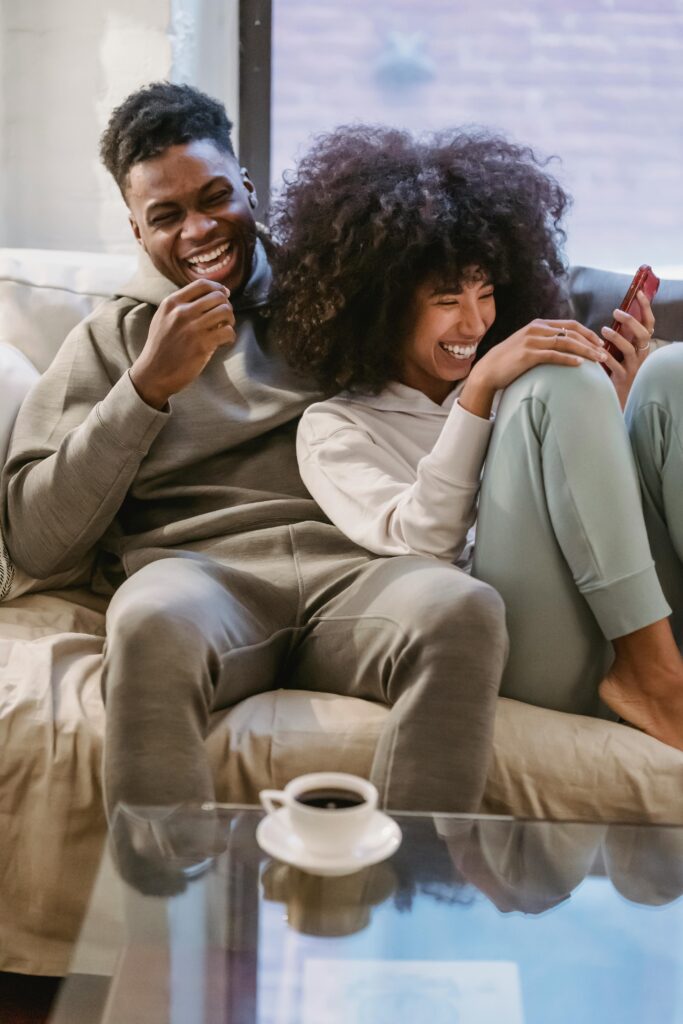 happy couple on sofa 