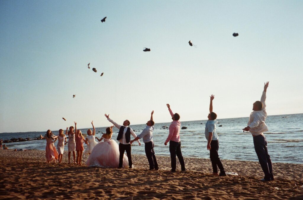 bridal group on beach having fun
